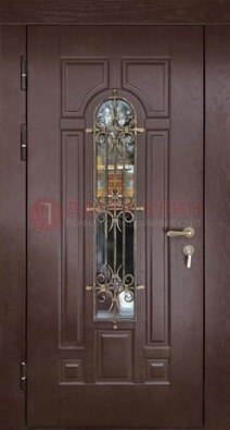 Темная железная дверь со стеклом и ковкой для частного дома ДСК-156 в Ярославле