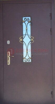 Металлическая дверь со стеклом и ковкой ДСК-77 в Ярославле